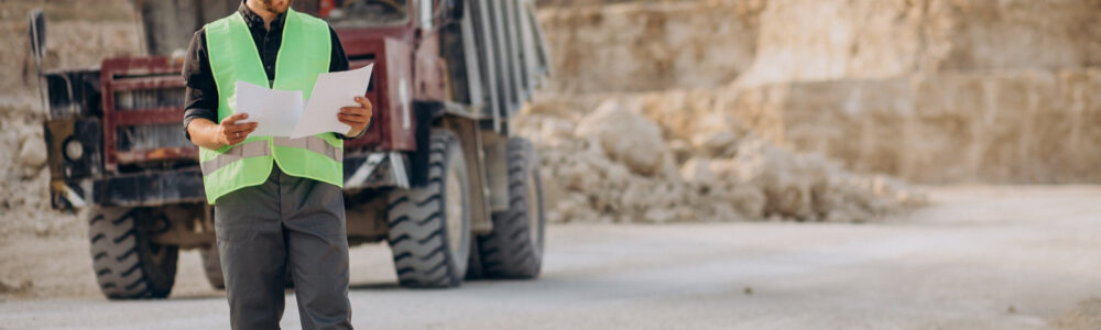 male-worker-with-bulldozer-in-sand-quarry